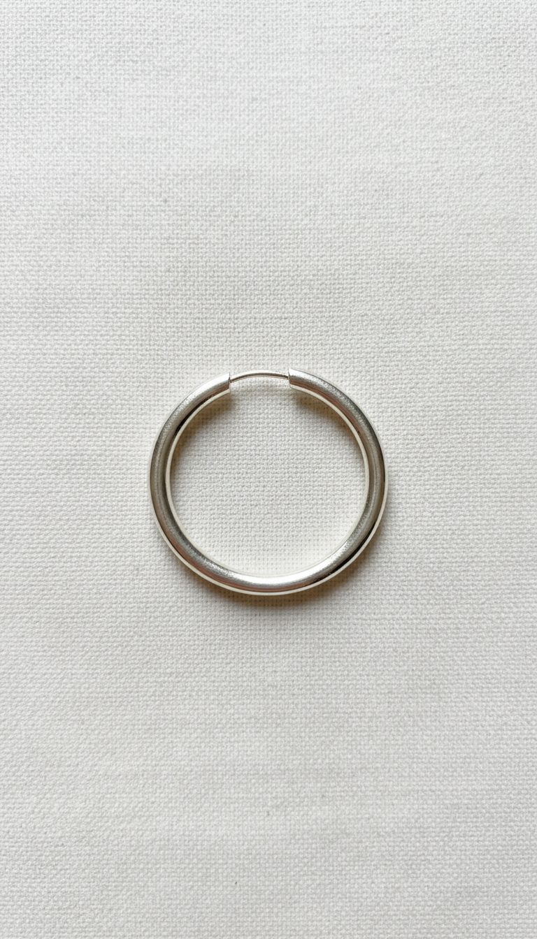 Sterling Silver Hoop Earrings With Sculpted Twist